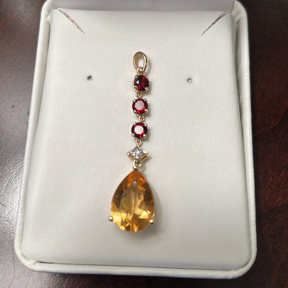 New Beautiful, 14 karat gold, garnet, golden citrine, and a diamond 2 in pendant